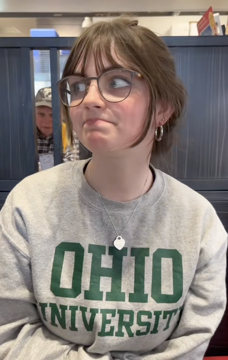 young woman sitting in a restaurant